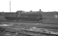 Looking across the ash roads in the shed yard at 52K Consett in February 1964. Resident Q6 0-8-0 no 63379 stands beyond, having arrived earlier with a train of empty steel flats [see image 23814]<br><br>[K A Gray 15/02/1964]