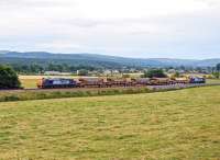 DRS 37218 and 37423 top and tail 5 autoballasters past Beauly on their way to Strathcarron on 8 August in preparation for overnight engineering works. <br><br>[John Gray 08/08/2013]