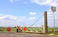 Heather opening the level crossing gates at Shippea Hill in May 2011.<br><br>[Ian Dinmore 21/05/2011]