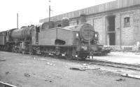 Gresley J50 0-6-0T no 68933 stands with a WD Austerity 2-8-0 alongside Wakefield shed on a March day in 1961. <br><br>[K A Gray 12/03/1961]
