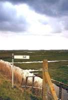 Not a good place to forget your umbrella - exit from Berney Arms, Norfolk, in March 2004, with storm clouds gathering.<br><br>[Ian Dinmore 22/03/2004]