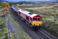 DB Schenker liveried Class 66 No.66101 at Tomatin on 26 October heading north with a heavily laden ballast train. <br><br>[John Gray 26/10/2013]