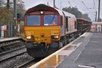 66041 passes through Kirknewton station with a Dalzell - Tees steel train on 26 November.<br><br>[Bill Roberton 26/11/2013]