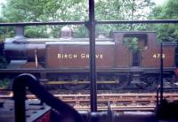 Class E4 0-6-2T no 473 <I>Birch Grove</I> seen through a window on the Bluebell Railway in 1971.<br><br>[John Thorn /07/1971]