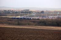Looking south over the Fife Circle with a passing 170 on 28 January 2014. In the background is the new Halbeath Park and Ride and Crossgates village.  A rail halt is mooted.<br><br>[Bill Roberton 28/01/2014]