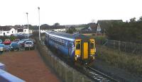 Scotrail DMU 156512 on 2A05 Kilmarnock to Girvan passing the abandoned branch platform at Barassie on 23 January 2014. Housing now covers much of the land once occupied by the former Barassie railway wagon works.<br><br>[Ken Browne 23/01/2014]