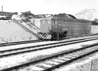 View from a train passing Roughcastle coal loading point, west of Falkirk High, on a cold and snowy 1 March 1986. The loco is F C Hibberd 'Planet' 4wDM 3716 of 1955, which is now preserved on the Tanfield Railway.<br><br>[Bill Roberton 01/03/1986]