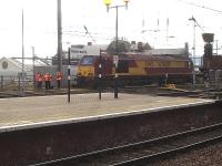 A group of staff undergoing a training exercise that appeared to revolve around Thunderbird 67024 stabled alongside Newcastle Central station during the late morning on 4 February.<br><br>[David Pesterfield 04/02/2014]
