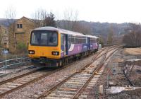 The new trailing crossover at the east end of Todmorden station associated with the reinstated north - south curve, seen here on 10 February 2014 as Northern Pacer 144009 departs with a service from Manchester to Leeds.<br><br>[John McIntyre 10/02/2014]