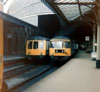 A class 108 dmu standing alongside a class 124 trans-Pennine unit in the old platforms 10 and 11 at York in July 1979. These platforms are currently (2014) numbered 6 and 7 [see image 34776].<br><br>[Colin Alexander 15/07/1979]