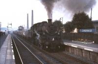 One of Grangemouth's Standard class 4 2-6-0s no 76113 runs south through Cumbernauld station on 3 August 1965 at the head of a mixed freight.  <br><br>[G W Robin 03/08/1965]