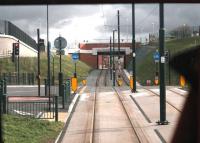 This steep switchback section of tram track is a reminder of why the L&YR did not go into the centre of Oldham but instead went by tunnel from Werneth to Central and on to Oldham Mumps, all skirting the edge of town. The new Metrolink line employs some substantial engineering to reach the town centre and this is a driver's view of the climb from Westwood to Oldham King St.  <br><br>[Mark Bartlett 13/02/2014]