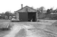 The goods shed at Swanage in March 1977. The track had gone but the first signs of preservation were evident on the station building behind the camera and in the shed where an ex BR Standard 4 2-6-4T was available to view. [Ref query 4208]<br><br>[John McIntyre /03/1977]