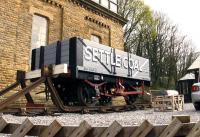 An ideal garden ornament for the discerning railway enthusiast! This 5 plank wagon in the grounds of the converted water tower at Settle station now greets visitors as they enter the station car park. [See image 42204]<br><br>[Colin McDonald 09/04/2014]