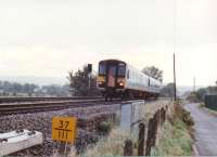 1988 - when men were men... and 155308 was factory fresh. The DMU is heading North from Newport towards Cwmbran, past the site of Ponthir station. That yellow number in the foreground would be a milepost, not a TOPS number.<br><br>[Ken Strachan /09/1988]