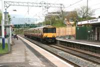 318252 runs into platform 2 at Cumbernauld on 9 May 2014 with the 11.22 terminating service from Springburn. <br><br>[John Furnevel 08/05/2014]