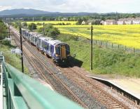 The 12.11 Edinburgh Waverley - Dunbar is about to run through Wallyford station on a warm and sunny 13 May. This service calls only at Musselburgh during its 25 minute end-to-end journey.  <br><br>[John Furnevel 13/05/2014]