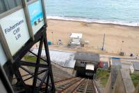 The gradient on each of the three Bournemouth cliff railways is very nearly 1:1. The most westerly of them is Fishermans Walk, serving Southbourne and Boscombe, which is younger (1935) and shorter (128') than its sisters. This image taken from the top station looks down the 45 degree slope to the promenade. The lifts generally operate from Easter to October each year.  <br><br>[Mark Bartlett 20/05/2014]