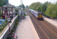 The 11.46 to Carlisle arrives at a well-kept Settle station on 20th May.<br><br>[Ken Strachan 20/05/2014]