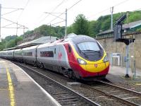 A Glasgow - Euston Pendolino draws away from Oxenholme on 29 May 2014.<br><br>[Bill Roberton 29/05/2014]