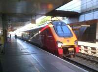 The 19.00 Virgin Trains London Euston - Wolverhampton pulls into Coventry on 6 July 2014. <br><br>[Ken Strachan 06/07/2014]