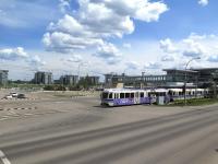 Southern terminus (and a transport interchange) of the 21km Edmonton LRT system is Century Park. This half barrier crossing just outside the station is one of many in the area crossing major and minor roads alike. With a frequent service of articulated trains on the LRT the barriers are often down against motorists and pedestrians but only for short periods. <br><br>[Malcolm Chattwood 13/06/2014]