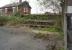 The abandoned platforms on the north side of Patricroft station, looking across Green Lane towards the Queen's Arms on 19 April 2014. [Ref query 6548]<br><br>[John McIntyre 19/04/2014]