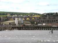 Looking across Tweedmouth Harbour towards three generations of bridges, with a northbound Voyager crossing the Royal Border Bridge on 29th July. The photographer's great great great grandfather worked as a stonemason on the rail bridge construction in 1849-50.<br><br>[David Spaven 29/07/2014]
