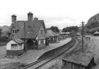 The Mound station in September 1961 looking south along the main line towards Inverness. The station had closed the previous year along with the Dornoch branch, which can just be seen entering the station on the extreme left of the picture. [See image 9749] <br><br>[David Stewart 08/09/1961]