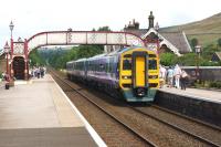A Carlisle to Leeds service comprised of 1588816 and 153304 calls at Settle on 26 July 2014.<br><br>[John McIntyre 26/07/2014]