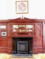 Part of the restored waiting room at Inverurie station in August 2014, complete with GNSR coat of arms hanging above the fireplace.<br><br>[Jim Peebles 08/08/2014]