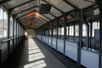 The interior of the 1902 covered walkway at Lancaster  station on a sunny 7th July 2014.<br><br>[Colin McDonald 07/07/2014]
