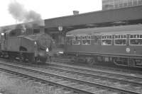 A DMU waiting at the platform at Doncaster in July 1961 alongside Gresley J50 0-6-0T 68928 (with 68917 coupled behind) standing on the centre road.<br><br>[K A Gray 29/07/1961]