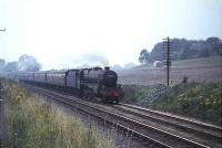Black 5 no 45359 photographed heading towards Cumbernauld on 4 August 1965 with a Glasgow - Dunblane train.<br><br>[G W Robin 03/08/1965]
