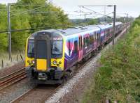 The TransPennine 14.16 from Edinburgh to Manchester Airport, formed by 350401, passing Camps Junction at speed on 9 September 2014.<br><br>[Bill Roberton 09/09/2014]