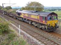 DBS 66100 with the Dalzell - Tees Yard steel empties passing the site of Camps Junction on 9 September.<br><br>[Bill Roberton 09/09/2014]