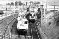 An electrically hauled up express passing a pair of EE Type 1s assisting another electric locomotive on an up train standing in the loop at Abington in 1980. [See image 23276]<br><br>[Colin Miller //1980]