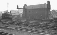 J21 0-6-0 65033 about to run past the 1891 LNER water tower at Newcastle Central on 7 May 1960. The locomotive (which pre-dates the water tower by two years) was heading for Darlington to pick up the RCTS/SDLS <I>J21 Rail Tour</I> (also referred to as the <I>Stainmore Special</I>) [see image 36091].<br><br>[K A Gray 07/05/1960]