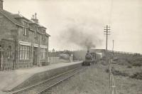 Ex-GNSR D41 4-4-0 62228 brings an up train into Mormond station on 6 July 1950.<br><br>[G H Robin collection by courtesy of the Mitchell Library, Glasgow 06/07/1950]