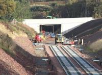 The new bridge providing farm access from the B6367 just north of the former Tynehead station. Seen here on 5 October 2014 with a construction machine crossing carrying a load of pipes.<br><br>[John Furnevel 05/10/2014]