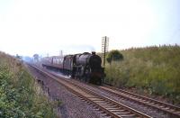Stirling based Black 5 no 45214 approaching Cumbernauld with a train on 3 August 1965.<br><br>[G W Robin 03/08/1965]