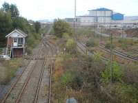 View east from Belasis Avenue overbridge along the line to Port Clarence on 15 October 2014. The operational Belasis Lane signal box controls the end of the twin track section from the junction with the main line south of Billingham station and access to the disused sidings to the right, serving the Haverton Hill chemical complex. [Security staff then arrived to question me as to what I was photographing, as it is seemingly forbidden to take views of the chemical plant.] <br><br>[David Pesterfield 15/10/2014]