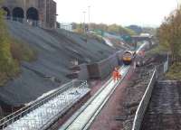 View south at Newtongrange on 14 October 2014 during tracklaying operations, showing the short distance between the Lady Victoria Colliery site, home of the Scottish Mining Museum (top left) and the under construction platform. The new station will have a direct footpath link with the museum. <br><br>[John Furnevel 17/10/2014]