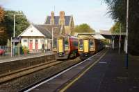 Autumn in Dorset, as a pair of SWT 159 units meets at Sherborne station on 20 October 2014. Left is 159014 on an Exeter to Waterloo train, while 159021 is operating the reverse service.<br><br>[John McIntyre 20/10/2014]