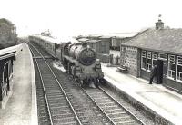 BR Standard class 4 2-6-0 76108 brings a down passenger train into Arnage station on 15 May 1959. <br><br>[G H Robin collection by courtesy of the Mitchell Library, Glasgow 15/05/1959]