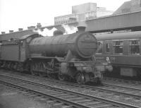 Gresley class O2 2-8-0 no 63973 with an up goods through Doncaster on 29 July 1961 passes the restaurant car of a Leeds - Kings Cross train standing at the platform.<br><br>[K A Gray 29/07/1961]