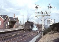 Beattock based BR Standard class 4 2-6-0 no 76098 standing in the platform loop at Symington with an up ballast train on 25 March 1966.<br><br>[John Robin 25/03/1966]