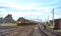 EE Type 4 D320 runs south through Symington station with an up WCML train in July 1965. <br><br>[John Robin 10/07/1965]