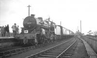 Ex-LMS <I>Crab</I> 2-6-0 42737 with <I>Scottish Rambler No 3</I> at Symington on 29 March 1964 having just returned from a trip along the branch to Broughton. 42737 had run round and was now preparing to take the special on the next leg south to Beattock. <br><br>[K A Gray 29/03/1964]