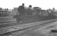 Shed scene at Nottingham in May 1961, with Fowler 2P 4-4-0 40682 at the end of a line of withdrawn ex-LMS steam locomotives awaiting disposal.<br><br>[K A Gray 13/05/1961]